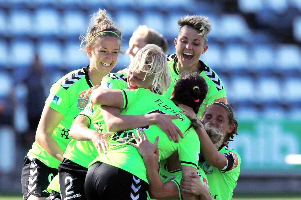 Canberra United celebrate victory in the W-League Semi Final match between Melbourne Victory and Canberra United at Simonds Stadium.
