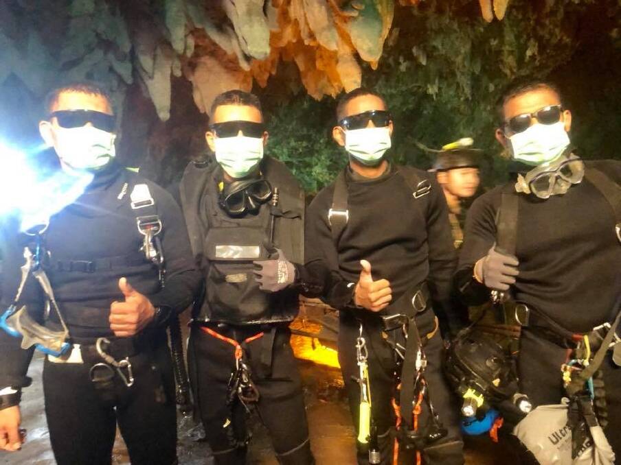 Three Thai Navy SEALs and a Thai doctor stayed with the boys overnight and were the last people out of the cave. Photo: Facebook/Thai Navy SEALs