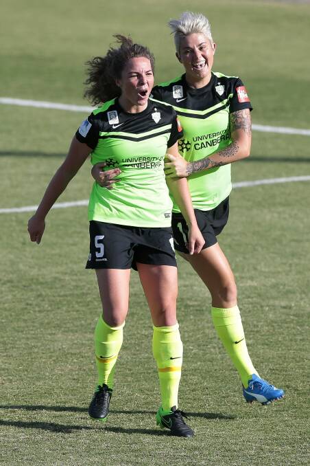 Canberra United's Jenna McCormick with teammate Michelle Heyman. Photo: Jeffrey Chan