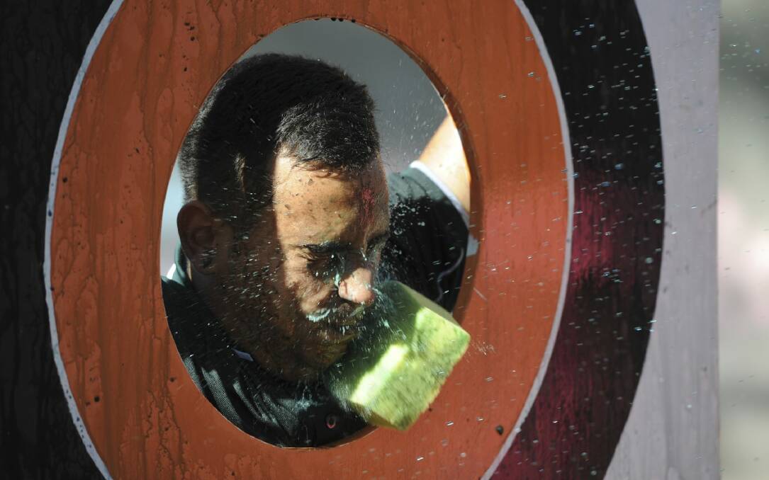 Sonione Wakabut Rogers, 20, of Kambah, was the target for youngsters who hurled coloured water soaked sponges at him at Gugan Gulwan Aboriginal community centre.  Photo: Graham Tidy