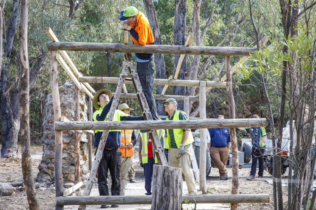 ACT Parks and Conservation staff work with volunteers to restore Tidbinbilla Hut, a site used for decades as a camping and picnic area before it fell into disrepair. Photo: Sitthixay Ditthavong