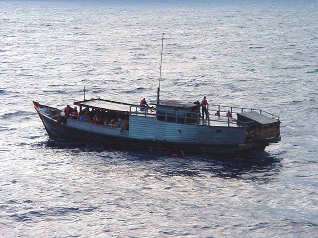 Asylum seekers rescued from a sinking boat. Photo: Department of Defence
