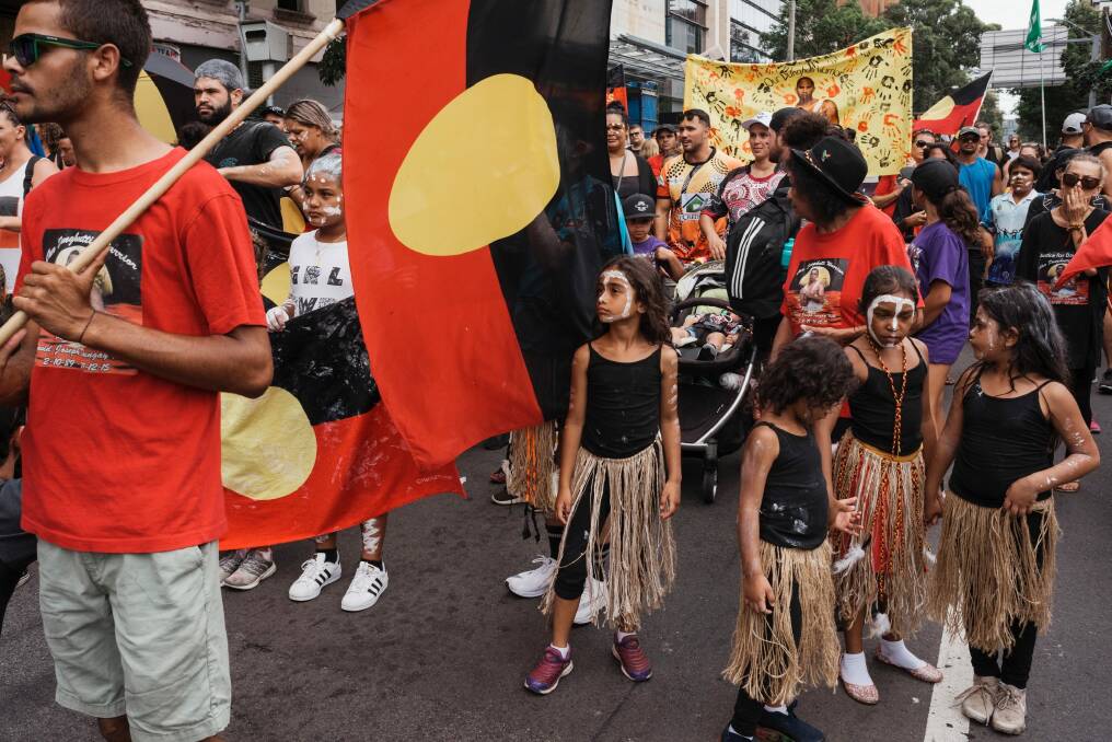 Protesters march through Redfern on Australia Day to protest celebrating on January 26. Photo: James Brickwood