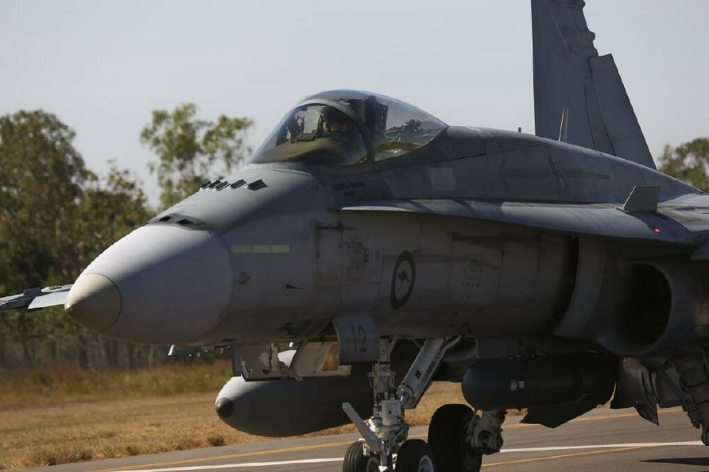 An F/A-18 A/B Hornet fighter jet. Four of the planes will fly over Canberra on Friday. Photo: Australian Defence Force