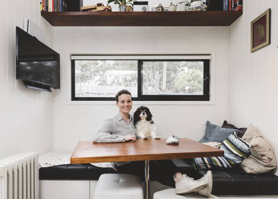 Jessica Conway in her tiny house with her dog Chloe. Photo: Jamila Toderas
