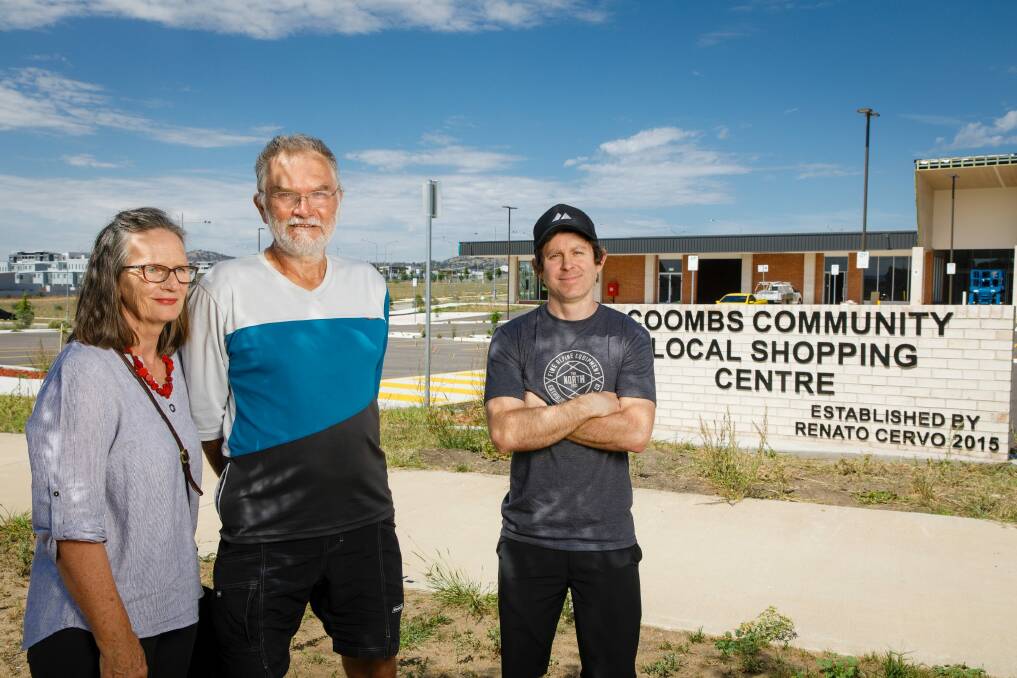 Coombs residents Alison and John Hutchison, and Damian Breach say they have not been able to get any answers from the ACT Government about when the privately-developed Coombs shops will be open for business. Photo: Sitthixay Ditthavong