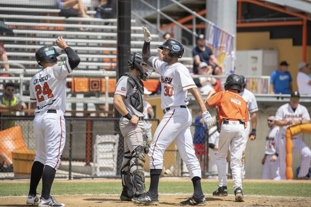 Canberra Cavalry's Zach Wilson and Michael Crouse celebrate. Photo: Sitthixay Ditthavong