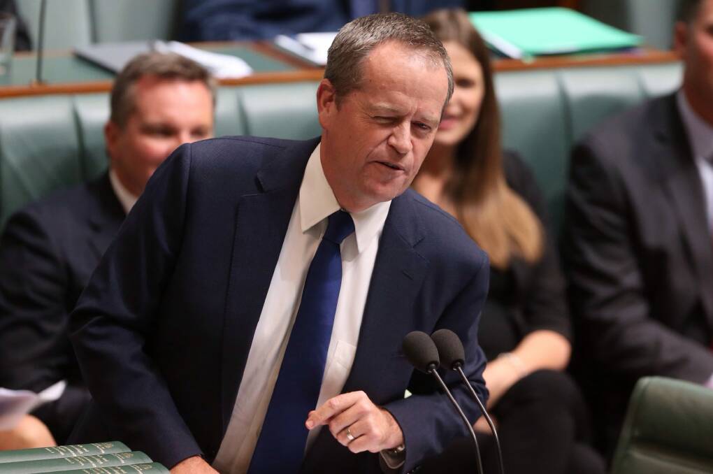 Opposition Leader Bill Shorten winks at Malcolm Turnbull while seeking to move a motion of no confidence in Prime Minister Tony Abbott during question time.  Photo: Andrew Meares
