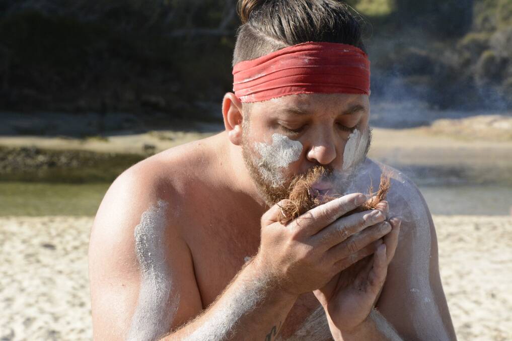 Dwayne Harrison summons the whale spirit during a Whale Dreaming Ceremony at Nangudga Inlet, near Narooma. Photo: Tim the Yowie Man