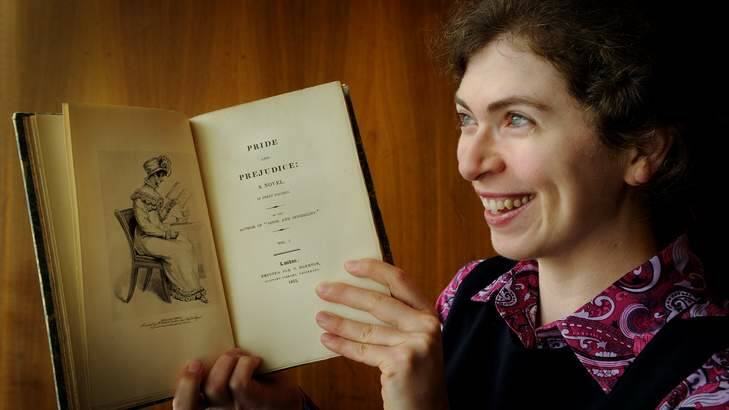 Susannah Helman from the NLA with a 19th century C version of the Jane Austen classic, Pride and Prejudice, which turns 200 this year. Photo: Colleen Petch