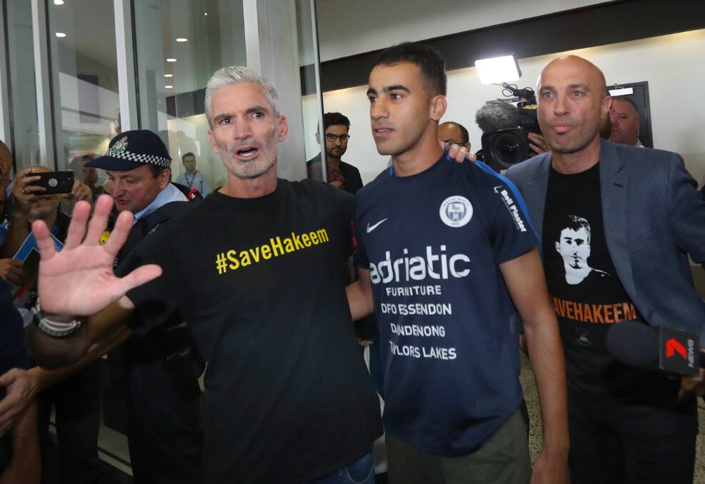 Craig Foster with refugee footballer Hakeem al-Araibi at Melbourne International Airport on February 12. Photo: AAP