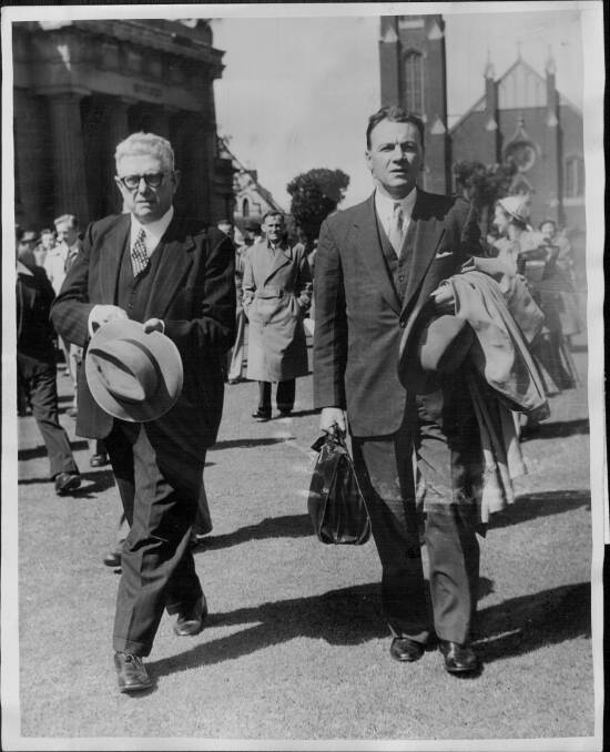Dr Bert Evatt, left, leaves the court after his brief to appear at the Petrov Commission was withdrawn. September 08, 1954. Photo: Bert Power