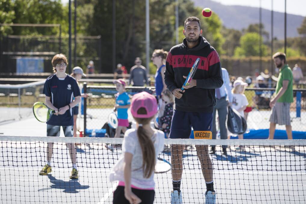 Nick Kyrgios got back to his tennis roots at Lyneham on Saturday. Photo: Sitthixay Ditthavong
