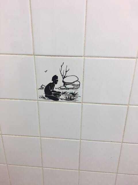 A photograph supplied by ACT Labor politician Bec Cody showing one of the tiles in the  men's urinal at the Sussex Inlet RSL, which she says is a disgrace. Photo: Supplied