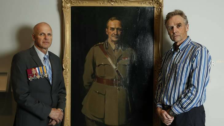 Heritage ... Brothers Jon and Charles Howse with a portrait of their grandfather, Sir Neville Howse at the Australian War Memorial.  Jon wears a copy of his grandfather's medals. Photo: Jeffrey Chan