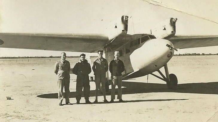 Reg Kupsch is the man standing closest to the plane in the group shot. Names of others are not known. Photo: Supplied