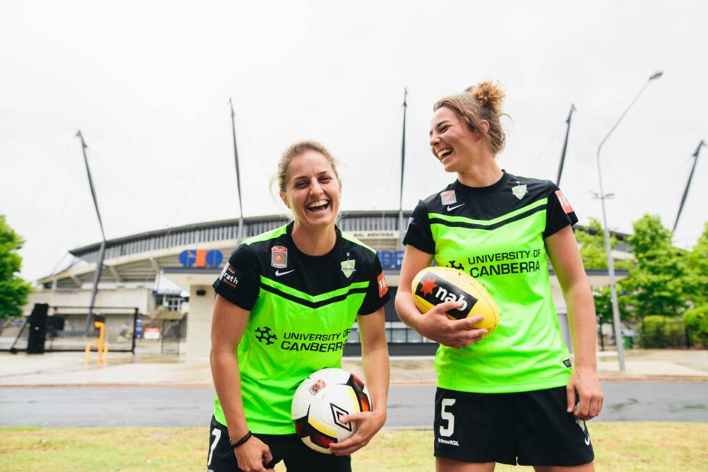 Canberra United players Ellie Brush and Jenna McCormick outside Canberra Stadium. Photo: Rohan Thomson