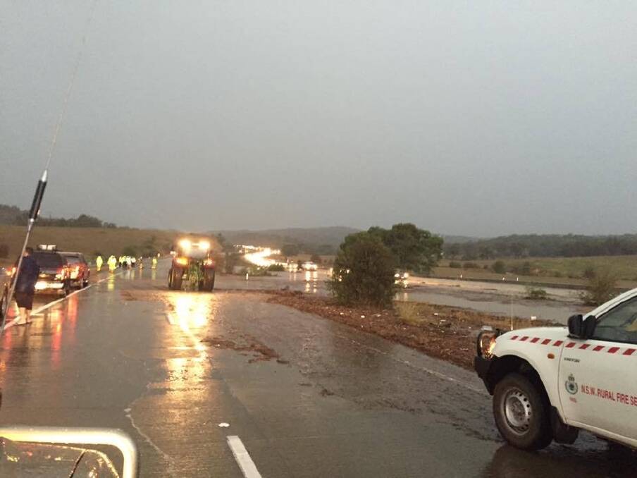 The NSW Rural Fire Service arrives to help stranded drivers on the Federal Highway. Photo: Tom Corra