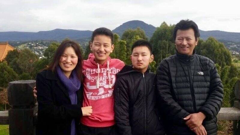 Kinley Wangyel Wangchuck  (in black second from right) with his mother Jangchu, father Tshering and brother Tenzin. Photo: Supplied