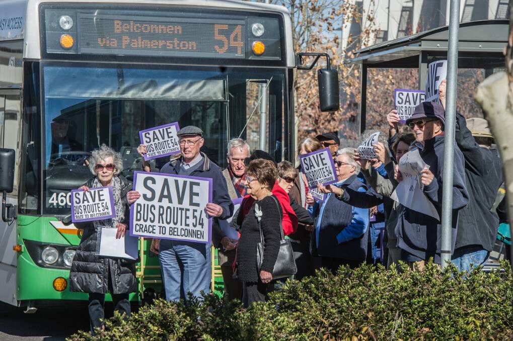 Residents of Goodwin Retirement Village, who stepped out in front of the 11.22am bus waving signs at a protest in July.  Photo: Karleen Minney