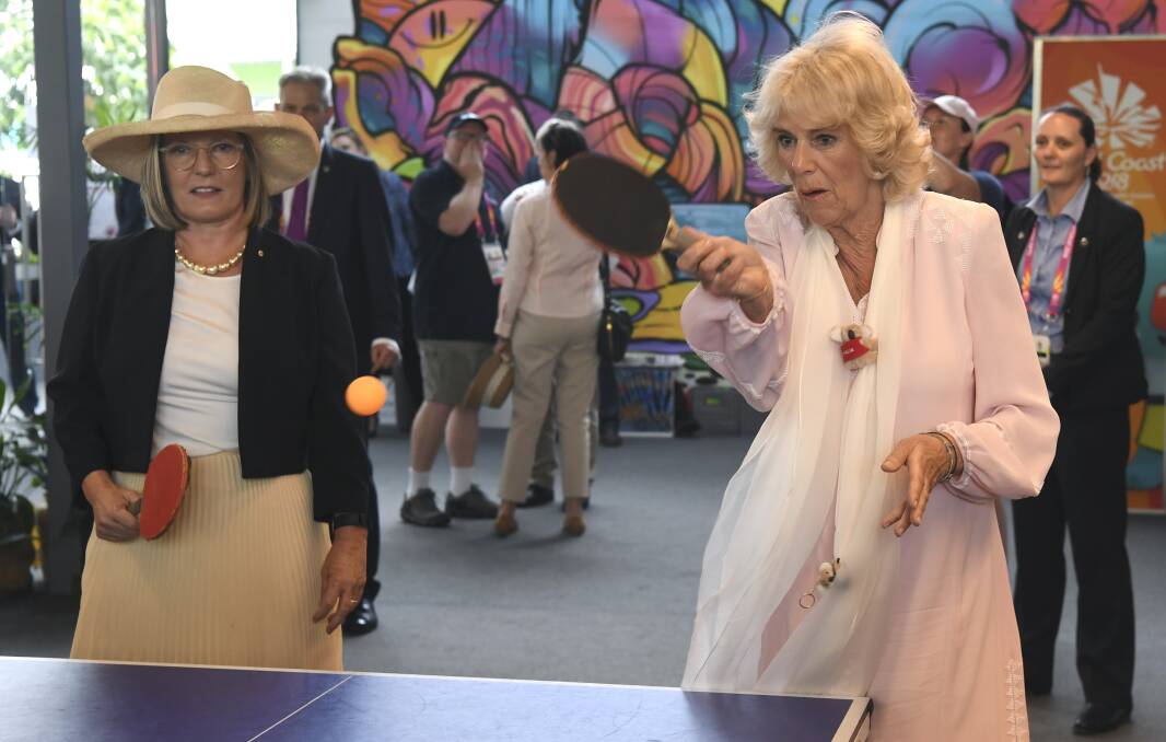 Camilla plays table tennis with Lucy Turnbull during a visit to the athletes' village at the Commonwealth Games on Thursday. Photo: AAP Image/ AFP Pool/ William West