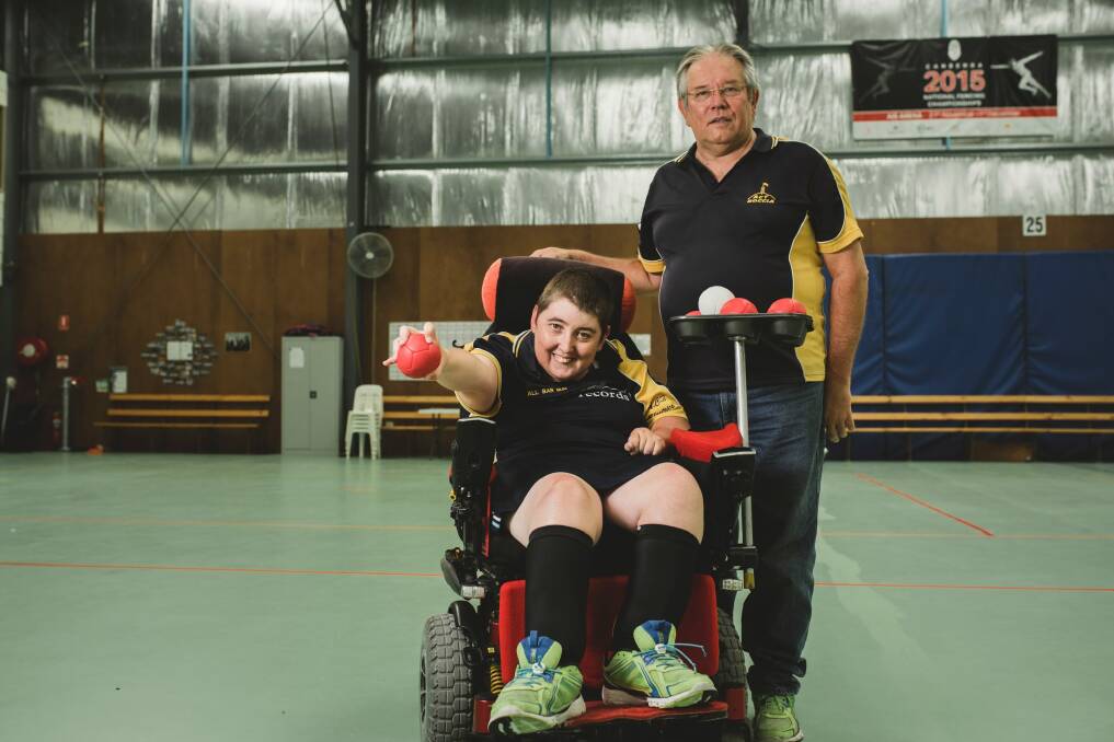 Corena Harrison, who has cerebral palsy, is the captain of the ACT boccia team competing in the Canberra Cup in Tuggeranong this weekend. Her coach Barry Yesberg says she is a fierce competitor. Photo: Jamila Toderas