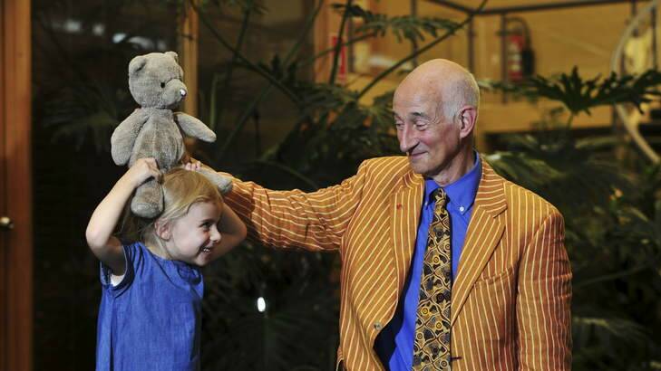 BLUES COMPANY: Appraiser Paul Atterbury chats with Paloma Smith du Toit, 4, of Carwoola, about her 35-year-old teddybear, Teddy Tahu. Photo: Melissa Adams