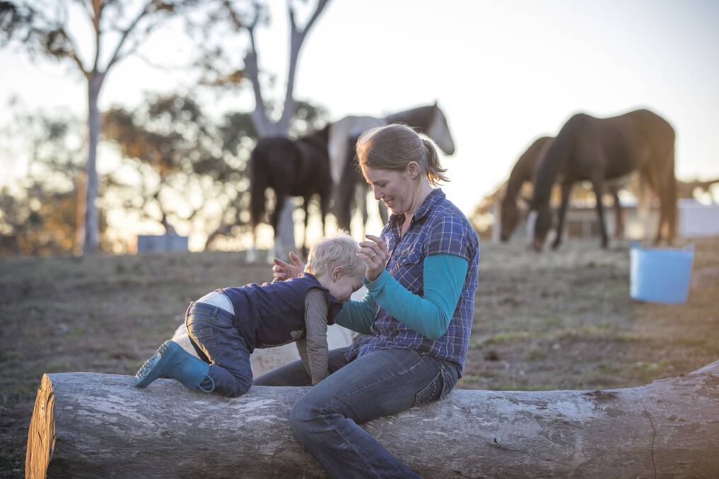 Gunning horse trainer Lauren Woodbridge with her three-year-old daughter Alanna Wright. Photo: Sitthixay Ditthavong