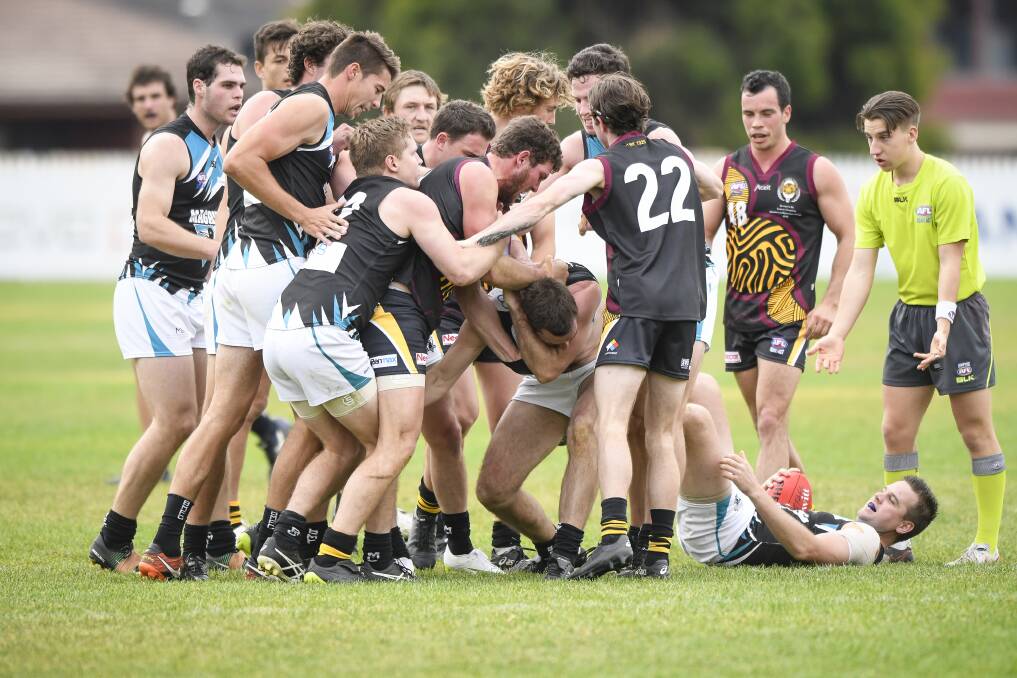 Belconnen Magpies players take exception to a tackle on Luke Donohoe from Queanbeyan's Joshua Bryce. Photo: Sitthixay Ditthavong