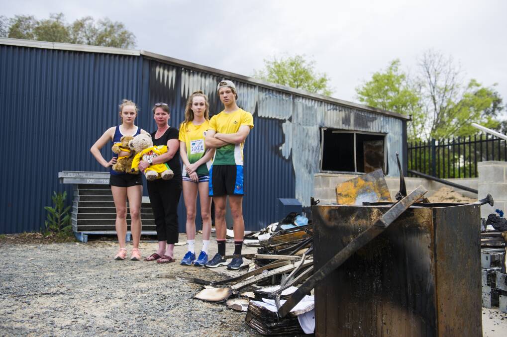 Woden Little Athletics Club secretary Mel Hardy, second from left, says it will go ahead with a meet on the weekend after Monday's devastating fire.  Photo: Dion Georgopoulos