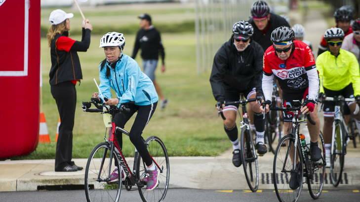 Turia Pitt leads off a group of cyclists from Parliament House on their way to Cooma on a leg of the Variety Cycle to Uluru. Photo: Rohan Thomson