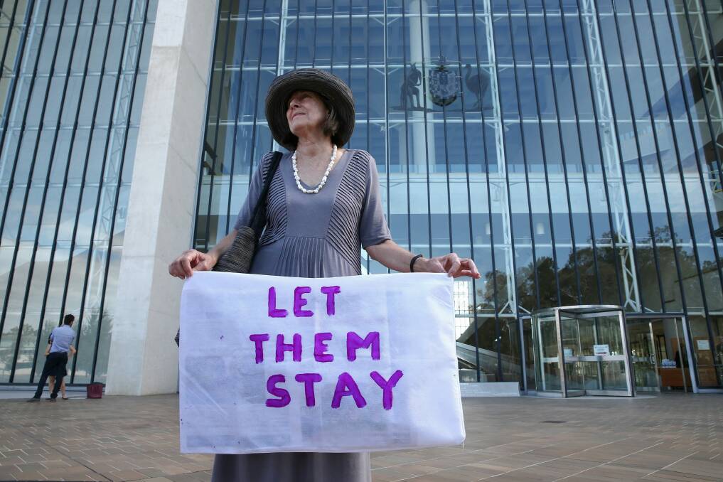 At the High Court in Canberra Susan Wood calls for asylum seekers, including Australian born children to remain in Australia.  Photo: Alex Ellinghausen