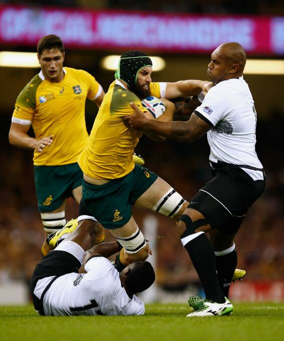 Scott Fardy is tackled by Nemani Nadolo (right) of Fiji. Photo: Laurence Griffiths