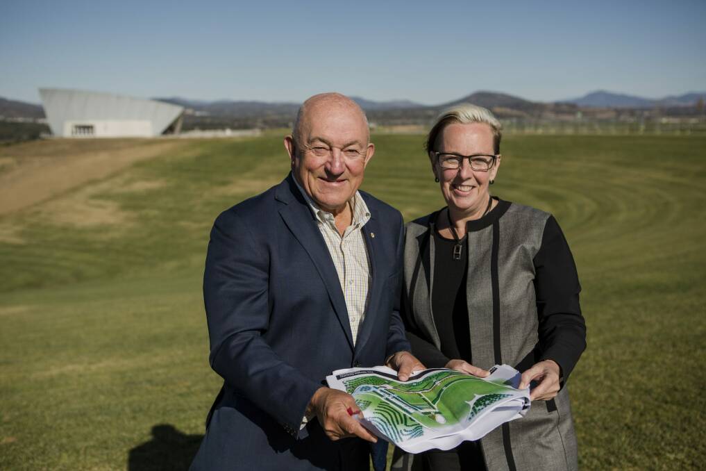 Patron of the AIDS Action Council of the ACT John Mackay and executive director Philippa Moss with plans for the construction of a HIV AIDS memorial site at the National Arboretum. Photo: Jamila Toderas
