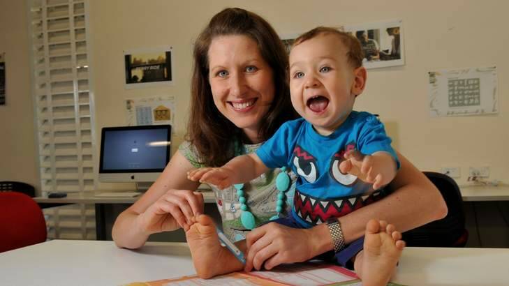 Dr Lisa Scharoun, assistant professor of graphic design at the University of Canberra, with her son Noah Martin. Photo: Graham Tidy
