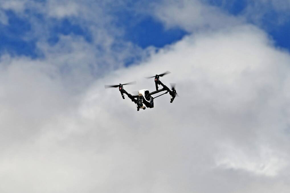 Airservices Australia is considering easing permission requests for drone flights near major airports. Photo: Paul Rovere