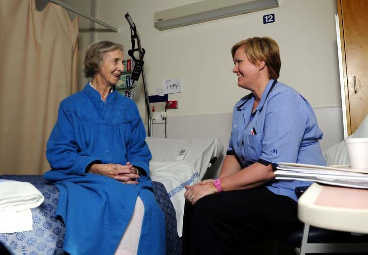 Discharge liaison nurse Jennie Pippen, right, speaks to patient Rayma Oldham at Canberra Hospital. Photo: Stuart Walmsley
