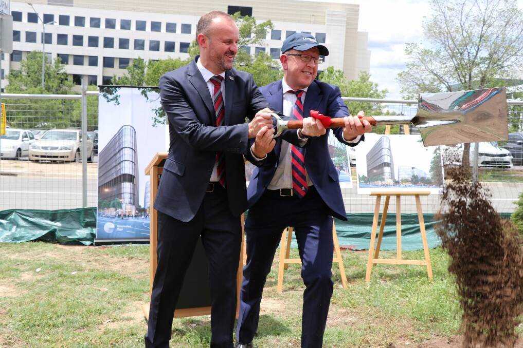 Chief Minister Andrew Barr was joined by the airports managing director, Stephen Byron, to turn the first sod for Constitution Place. Photo: Supplied
