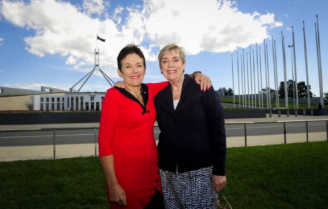 Former chief ministers Kate Carnell and Rosemary Follett outside Parliament House, more than 20 years after their election face-off. Picture: Melissa Adams