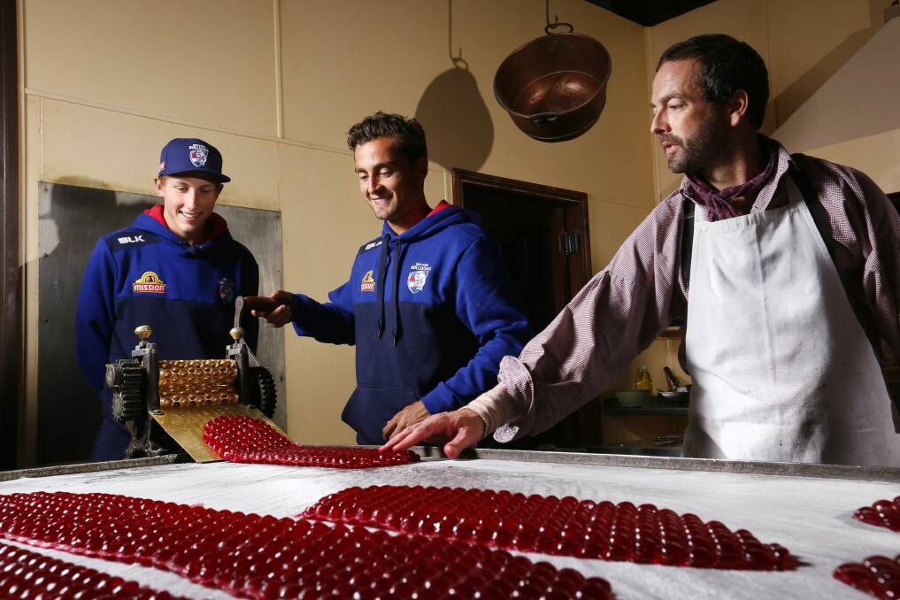 Bailey Dale, Dahlhaus and confectioner Ben Bignell make raspberry drops. Photo: Luka Kauzlaric