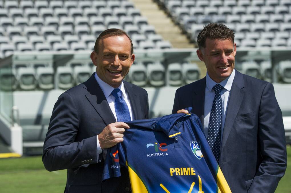 Prime Minister Tony Abbott announces that Michael Hussey will captain the Prime Minister's XI in January. Photo: Jay Cronan