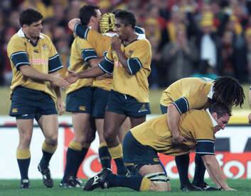 Brumbies celebrate beating the Lions with the Wallabies in 2001, James Holbeck, Joe Roff, Andrew Walker, George Smith and Justin Harrison.