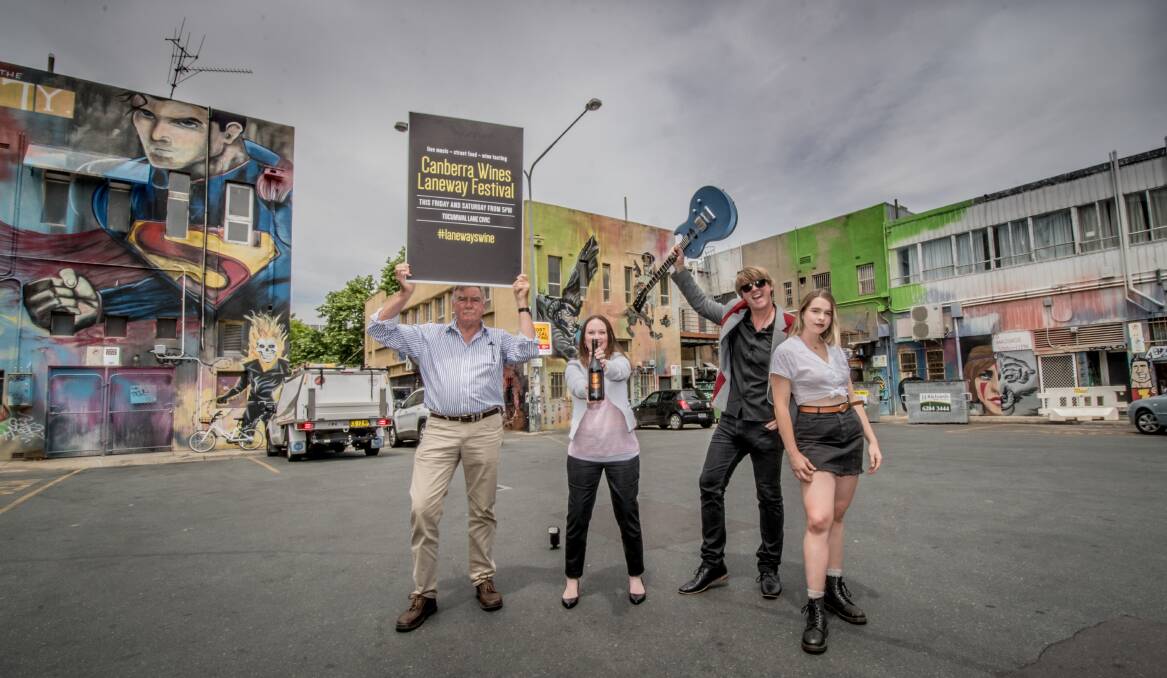 President of the Canberra District Wine Industry Association John Leyshon, local winemaker Stephanie Helm and local performers  "The Chesterfield Band", Cam Smith and daughter Tess Healey-Smith in Tocumwal Lane. Photo: Karleen Minney 