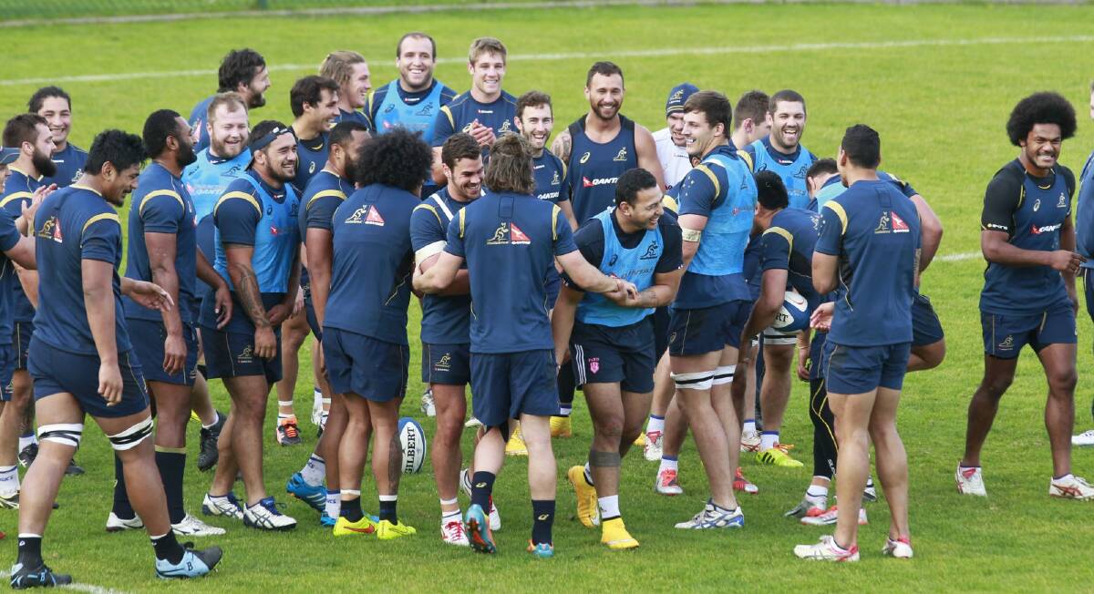Guest Wallaby: Krisnan Inu, centre, laughs during a training session with the Wallabies in Paris. Photo: AP
