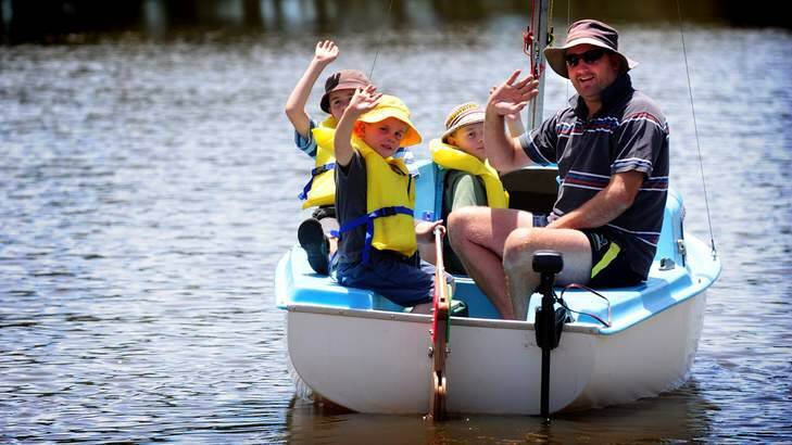 Gentle boating activity on Canberra's lake Burley Griffin. Sam Thomson takes his three sons Angus (5), Max (9) and Josh (10) out for some holiday fishing on the Lake. Photo: Karleen Minney