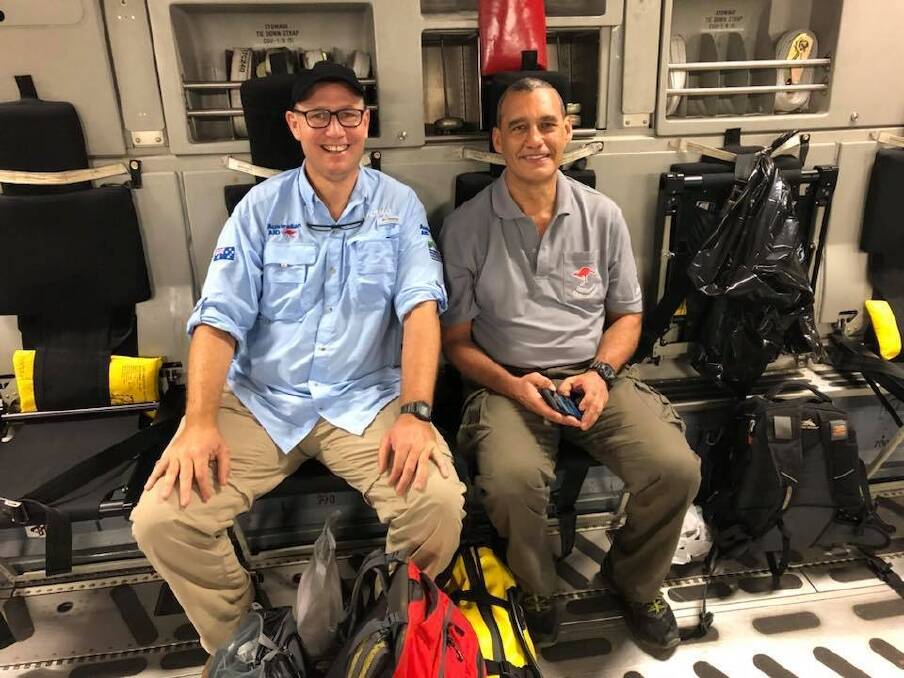 Richard Harris (left) and Craig Challen on their way back to Australia on an RAAF transport following the successful rescue mission. Their lives have been transformed. Photo: Richard Harris