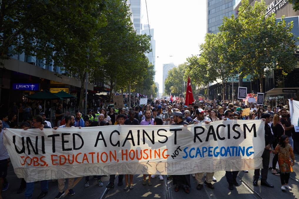 Demonstrators are seen during an anti-racist and anti-fascist rally in Melbourne. Photo: AAP