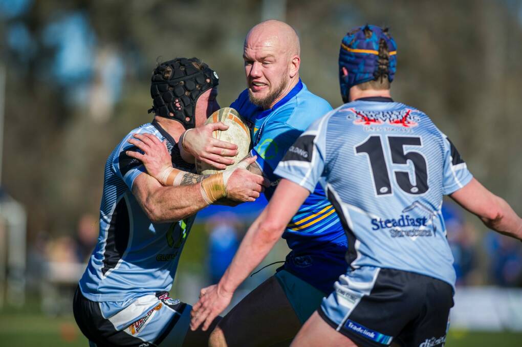 Warriors' Christopher Thorley takes on the Sharks defence. Photo: Dion Georgopoulos