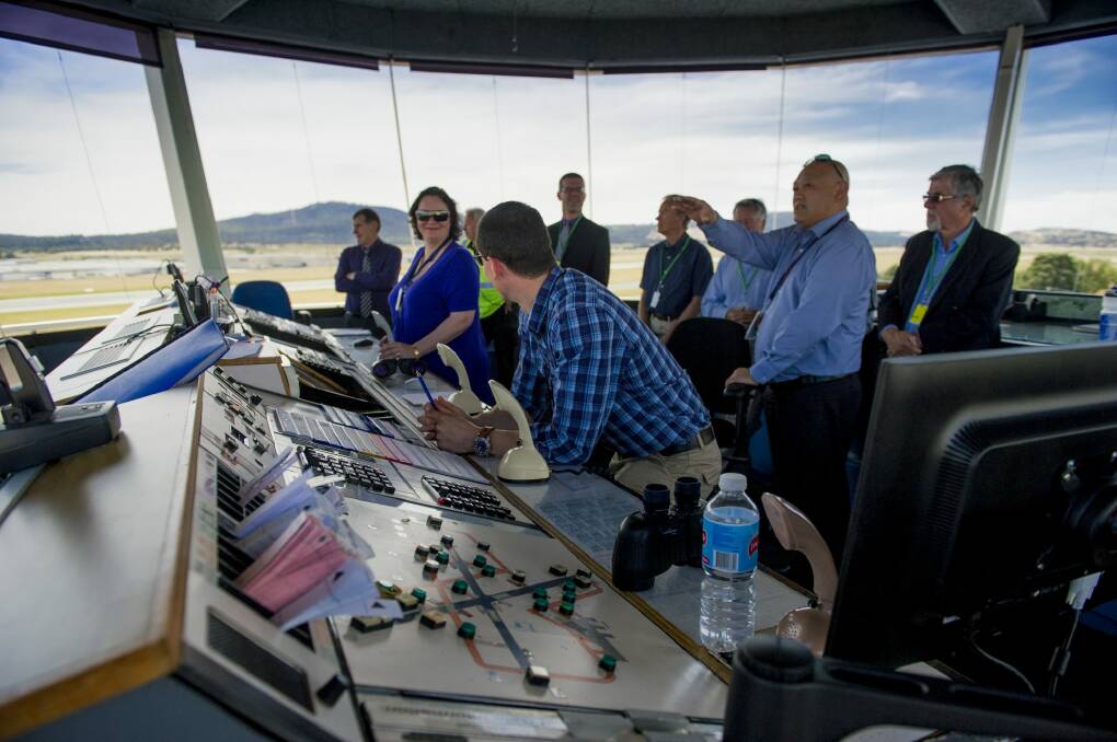 Grand views: The Canberra Airport Community Aviation Consultation Group is shown through the airport tower for the first time.
 Photo: Jay Cronan