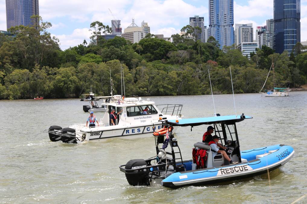 Volunteer Marine Rescue Brisbane search for a man who was reported missing after falling into the Brisbane River near the Kangaroo Point cliffs. Photo: Jocelyn Garcia